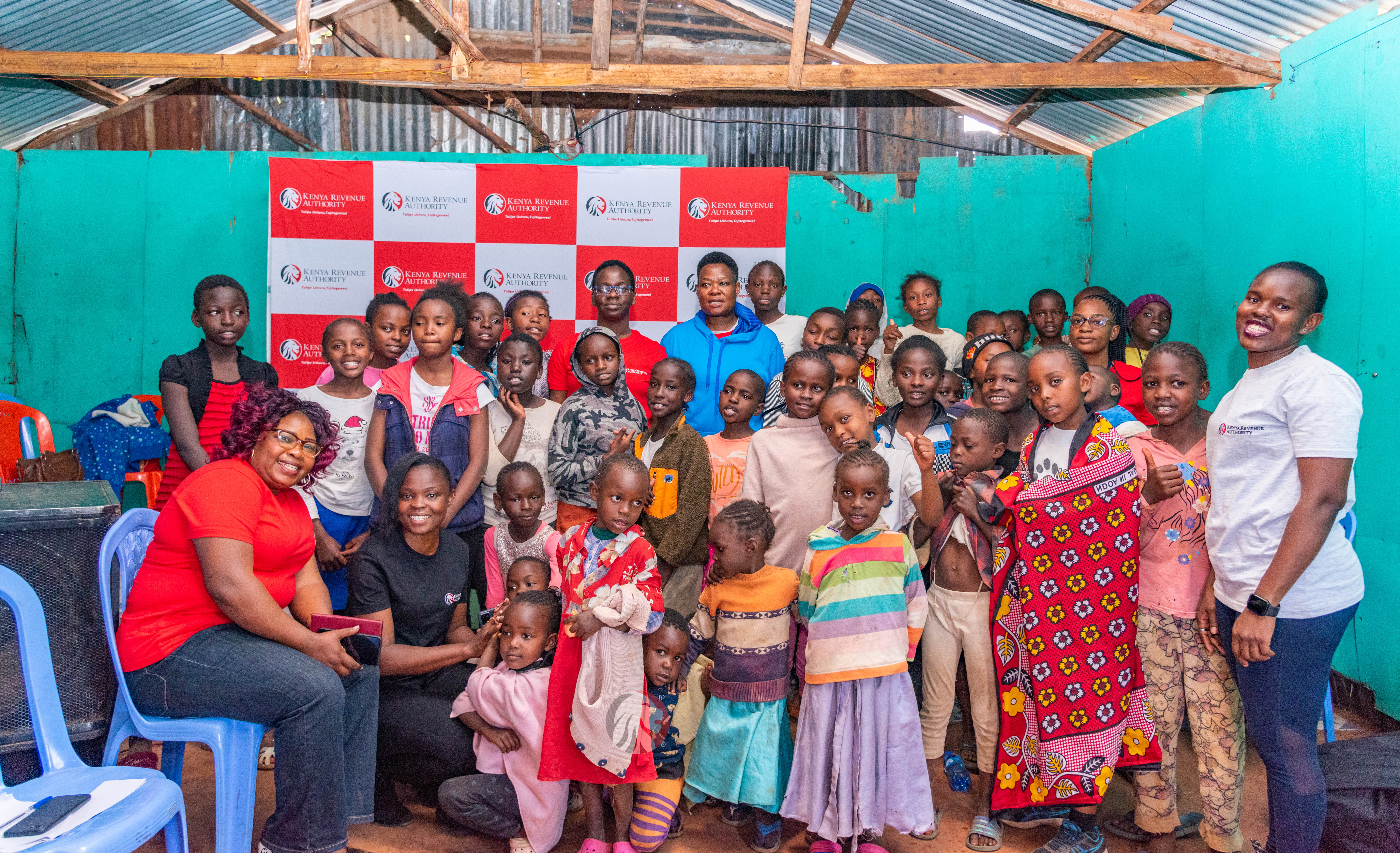 KRA mentors with primary school girls during the mentorship session in Soweto, Kibera in Nairobi